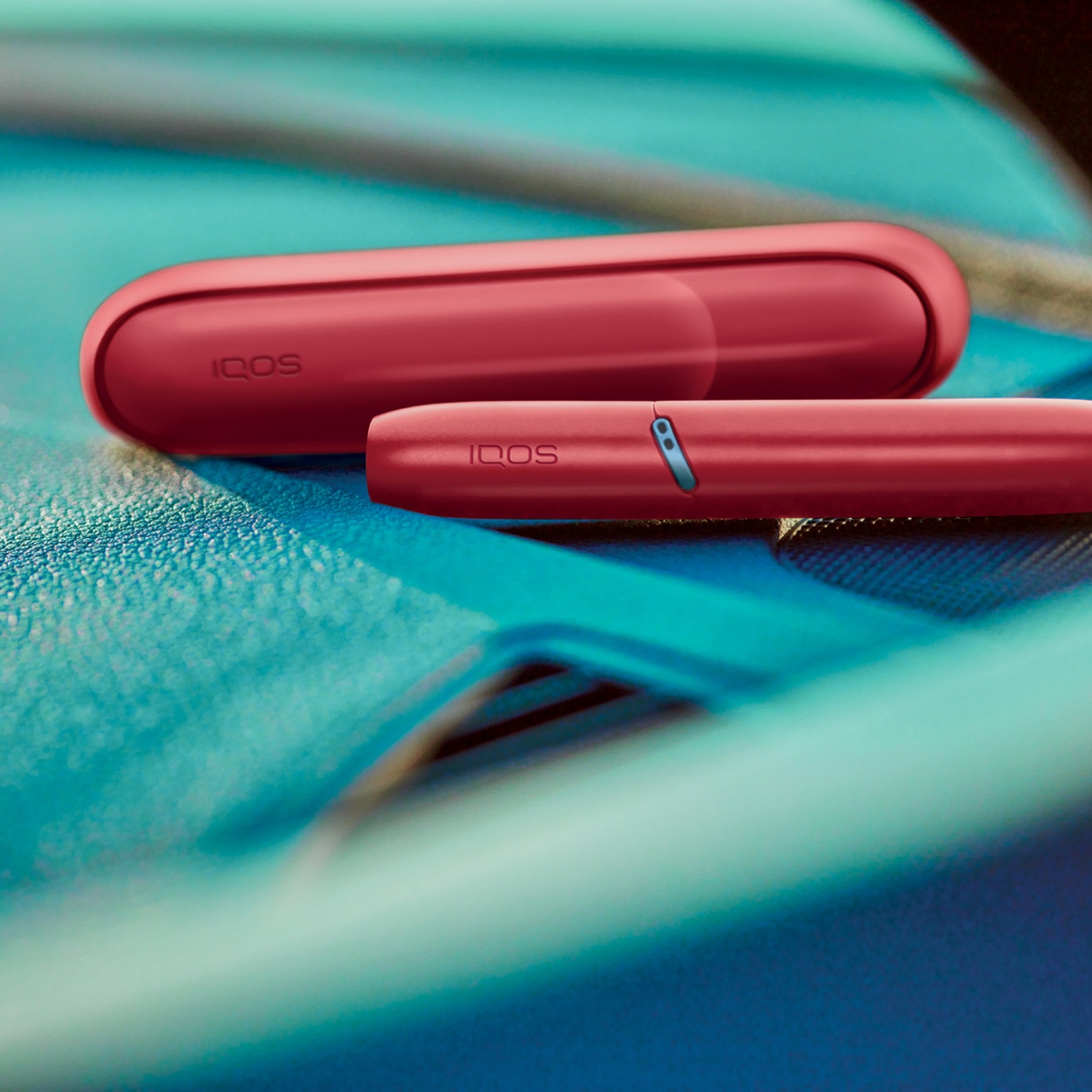 IQOS Originals Duo holder and pocket charger in red color.