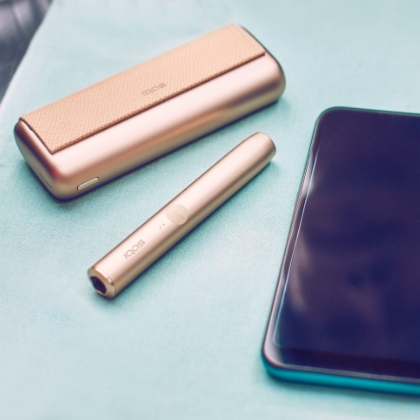 IQOS Iluma Prime in mobitel na mizi